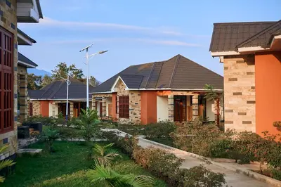 a row of houses with roofs at Orlando Cottages in Arusha