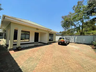 a car parked in front of a house at Emmalanta Safaris House in Arusha