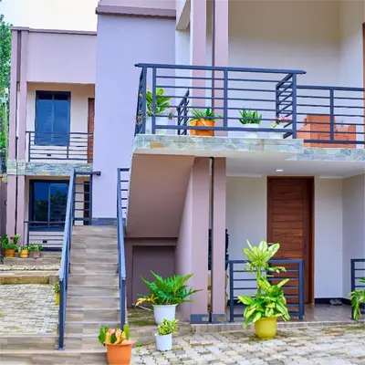 a house with a balcony with plants on it at Penthouse Moshono in Nkoanrua