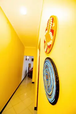 a wall with a picture of a mouth on a wall at Private Nest Apartment 2 in Nkoanrua