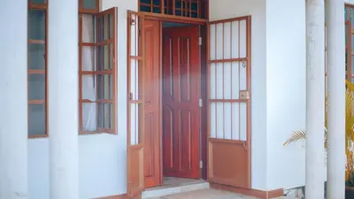 a pair of doors on a white building at Arusha 2bedroom in Arusha