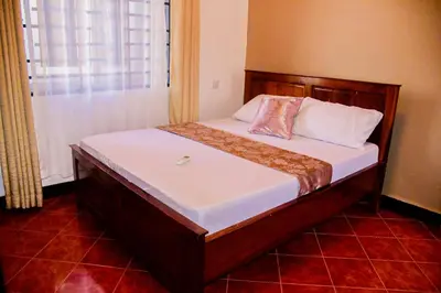 a bed in a small room with at Antelope homestay in Sanya Chini Station
